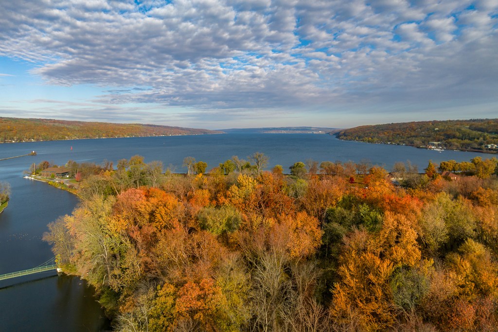 Fall, autumn, drone aerial image with view of Stewart Park at the south end of Cayuga Lake, Ithaca New York.