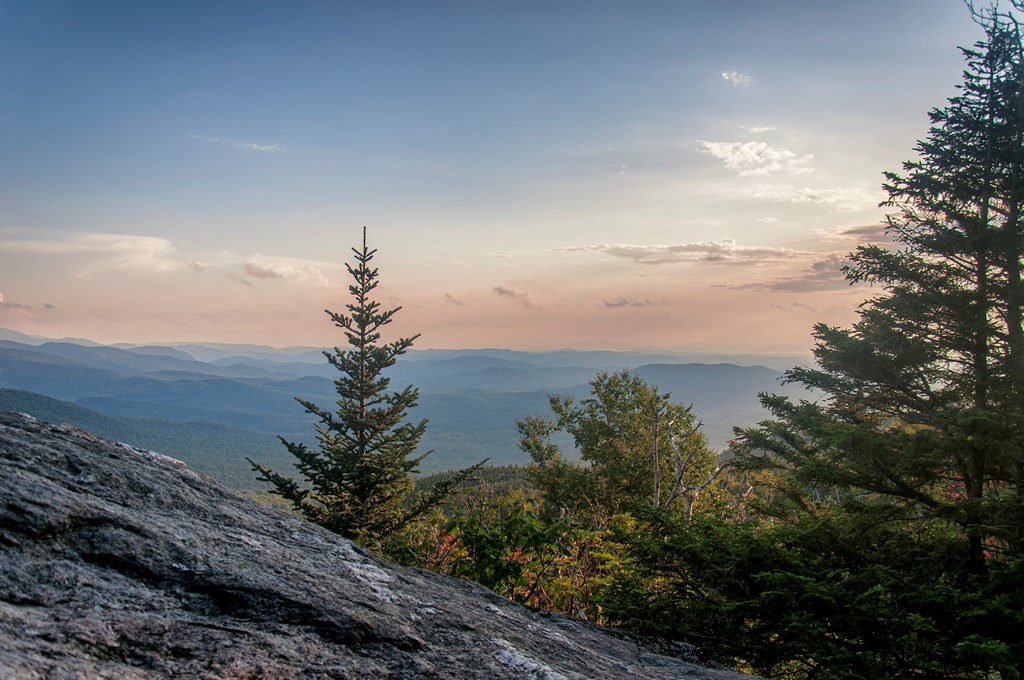 A view of mount mansfield state forest and landscape at sunset in underhill Vermont.