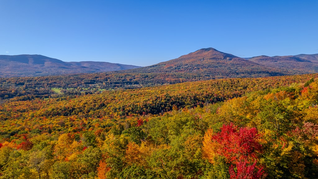 Beautiful autumn foliage is captured in the air by drone in the Green Mountains of Manchester, Vermont.